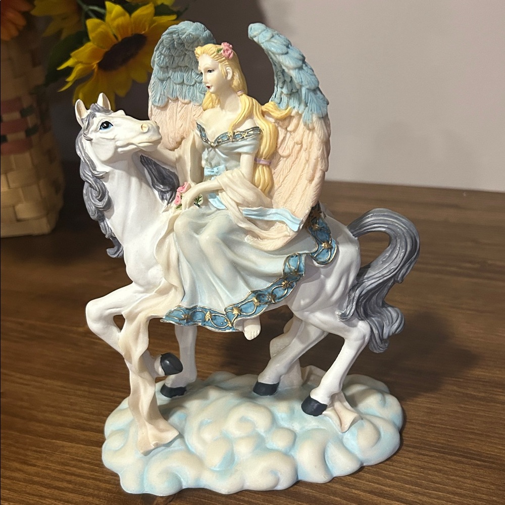 vintage figurine of a guardian angel riding a horse, manufactured by Young's Inc
